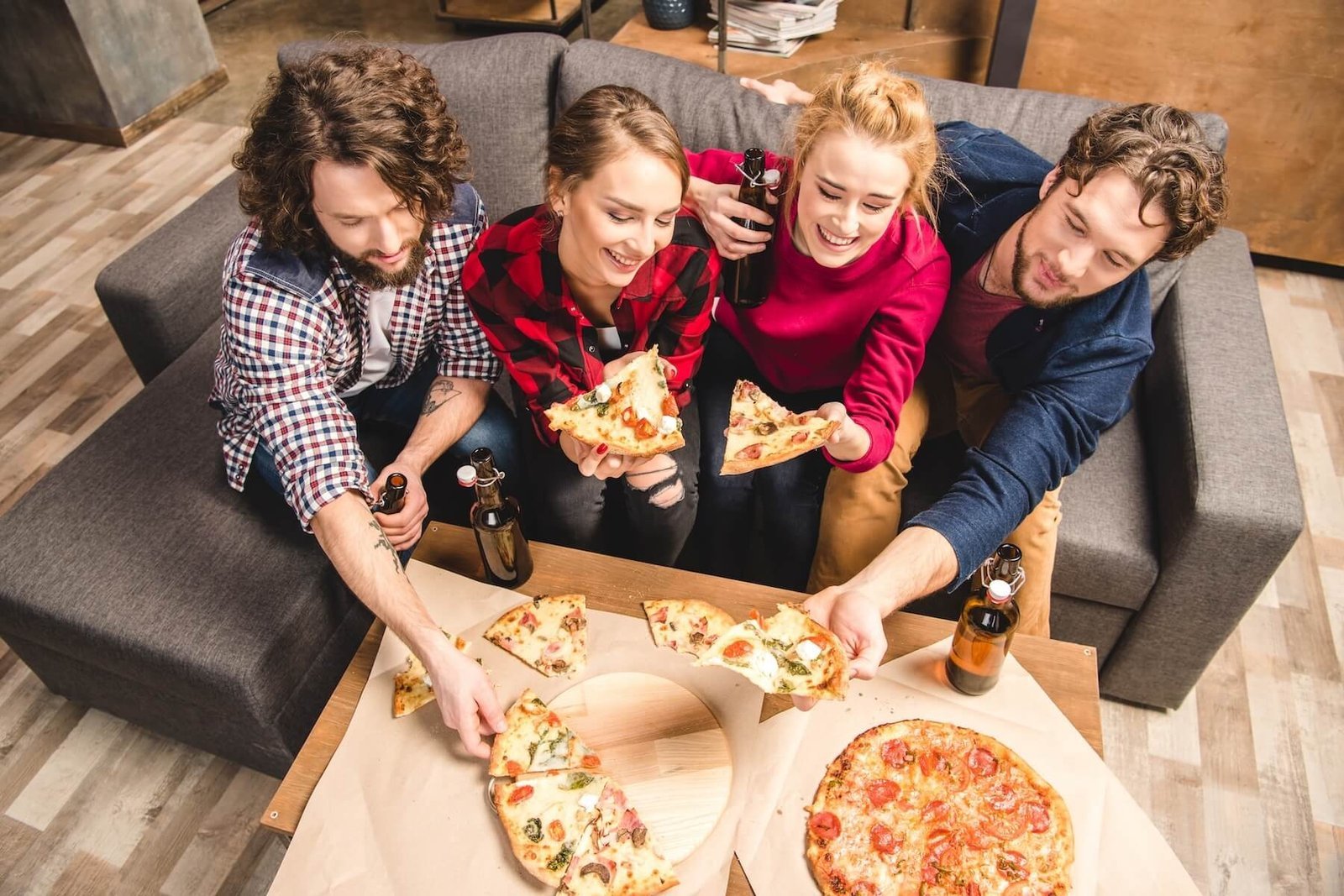 Group of guests sharing pizza